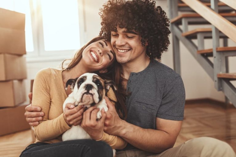 Man and woman holding new dog